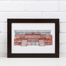 Load image into Gallery viewer, A detailed illustration of Aston Villa Football Stadium. The piece is in a black frame against a white brick wall.
