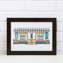Load image into Gallery viewer, A piece of Leeds United wall art. The artwork is a fineliner and watercolour print of the artist's hand drawn piece. It's photographed in a black frame against a white brick wall.