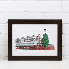 Load image into Gallery viewer, A framed print of Nottingham Forest Football Stadium, the detailed illustration is hand drawn by the artist Jessica Sian. The print is signed by the artist and photographed in a black frame.