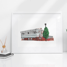 Load image into Gallery viewer, Nott'm Forest FC wall art. The piece is printed from Jessica Sian's original illustration of the City Ground. Photographed in a white frame on a white desk.