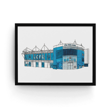 Load image into Gallery viewer, Leicester City wall art showing the King Power stadium. The piece is a print of the artist&#39;s original fineliner and watercolour painting. It&#39;s signed by the artist and in a black frame. 

