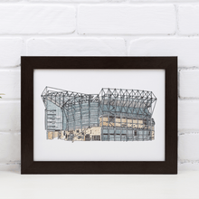 Load image into Gallery viewer, Newcastle United Football Stadium print, a detailed illustration of St James&#39; Park hand drawn and painted by the artist Jessica Sian. The piece is in a black frame against a white brick wall.
