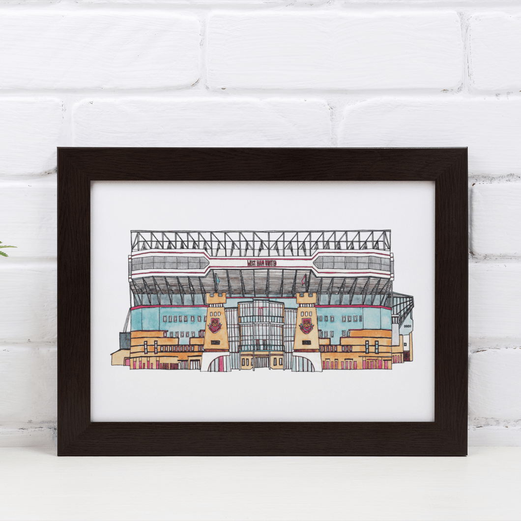 A framed print of West Ham United's Football Stadium, Upton Park. The piece is printed from Jessica Sian's original fineliner and watercolour artwork of the football ground.