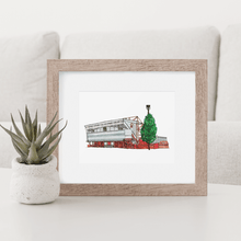Load image into Gallery viewer, Nottingham Forest art print of the City ground football stadium, the detailed illustration is printed from Jessica Sian&#39;s original artwork. Framed in a wooden frame and photographed on a white coffee table.
