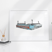 Load image into Gallery viewer, A detailed illustration of the Portman Road football stadium where Ipswich Town Football Club play. Printed from Jessica Sian&#39;s hand drawn artworks. The piece is in a white frame on a white table.
